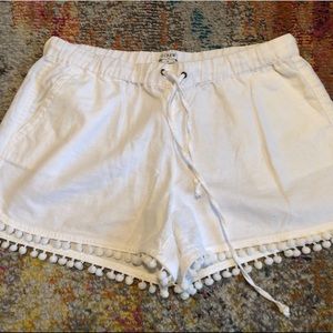 White shorts with Poms